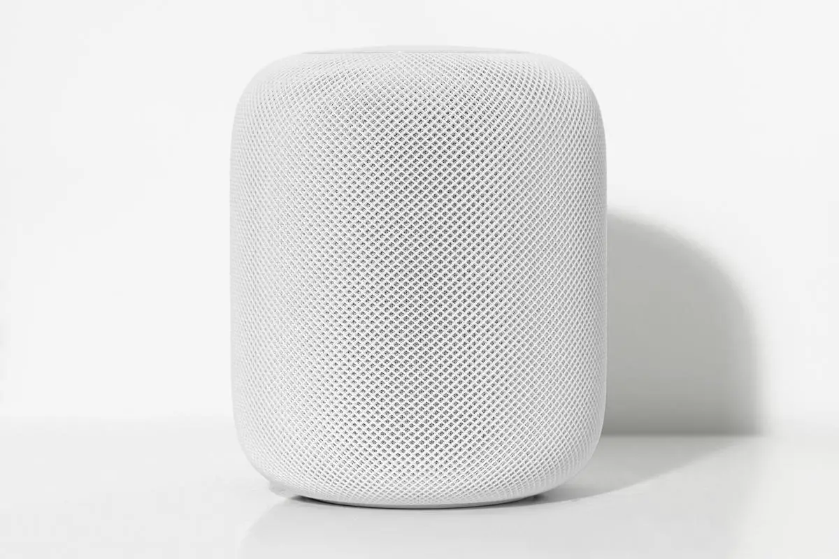 Image of a Apple HomePod speaker playing music.